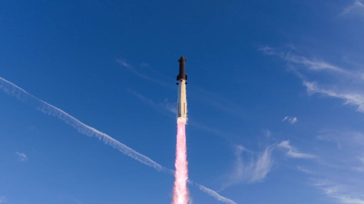 Starship climbs into a clear blue sky